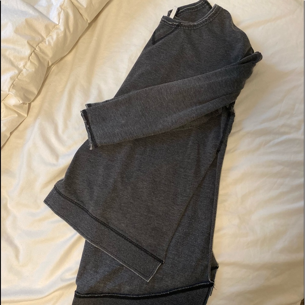 Adorable grey thin sweater with open side cut outs.